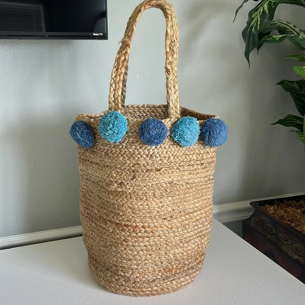 - Anthropologie Jute Braided Tote bag with  Pom Pom